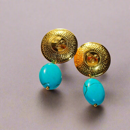 Beautiful handmade pieces with the face of the sun on top and a turquoise on
the bottom.